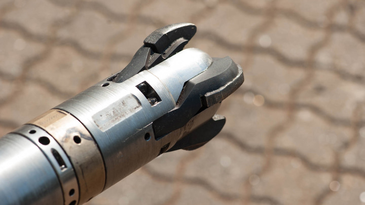 Well Miller with Expandable Bit used to safely mill restrictions, allowing bridge plug deployment during downhole operations.