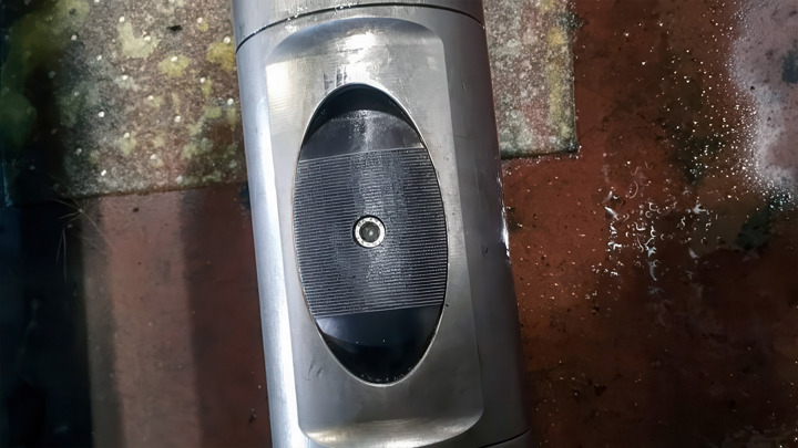 Close-up of a full-bore frac sleeve shifting tool, showing central mechanism used in high-volume single-run operations.