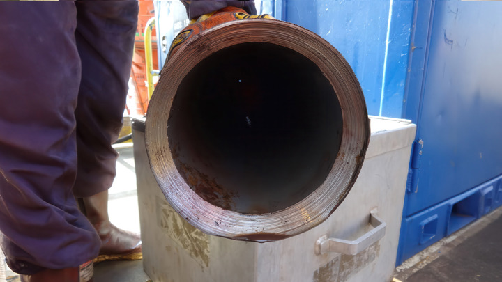 Close-up of tubing cut during deepwater operation with pipe under 30,000 lbs compression on drillship.