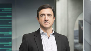 Marcelo Batocchio, Welltec's Vice President for Latin America, in business attire standing in a modern office setting.