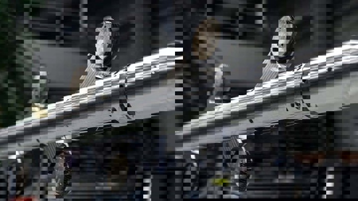 Close up view of a Welltec Tractor tool with multiple drive wheels, designed for downhole operations in complex wellbore environments.