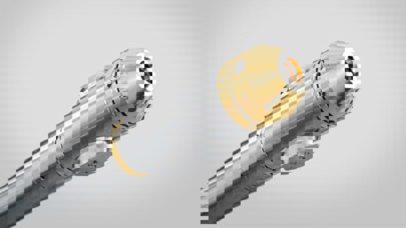 Sleek downhole tool featuring gold and steel components, used in oilfield operations for precision intervention.