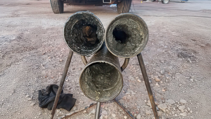 Three wellbore sections after lateral cleanout and toe perforation using the Well Cleaner Reverse Circulating Bit, showing removed debris.