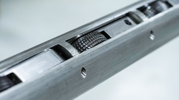 Close-up of a Well Tractor® drive wheel with textured surface, embedded in a tool body, used in a horizontal geothermal well operation.