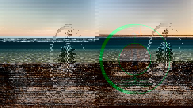 A digital illustration showing an offshore oil rig with a Welltec solution in the subsea environment, highlighted by a green circle.