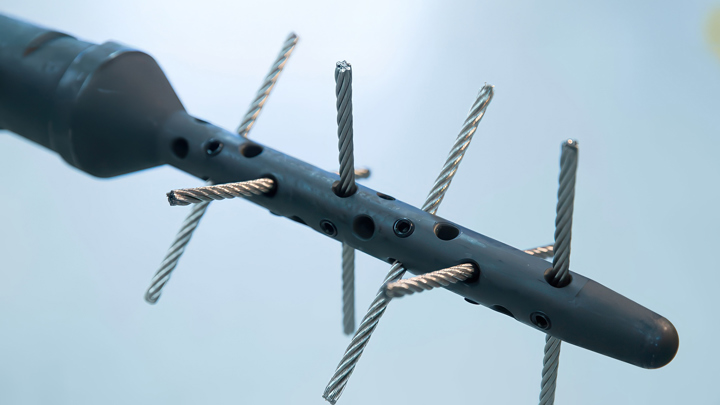 Close-up of a Well Miller® tool with extended rotating wires designed for removing carbonate scale in horizontal well tubing.