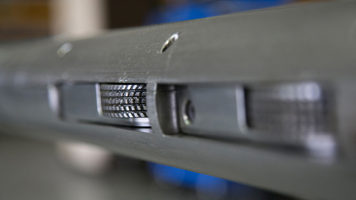 Close-up of a high-temperature cement bond logging tool used in well intervention to evaluate cement integrity in challenging downhole conditions.