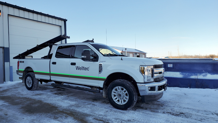 Welltec service truck equipped for E-line heavy workovers parked outside in a snowy, high-latitude environment.