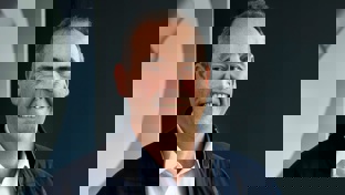 Paul Hazel, Global Solutions Director, standing in front of a modern Welltec display, wearing a white shirt and a navy jacket, smiling