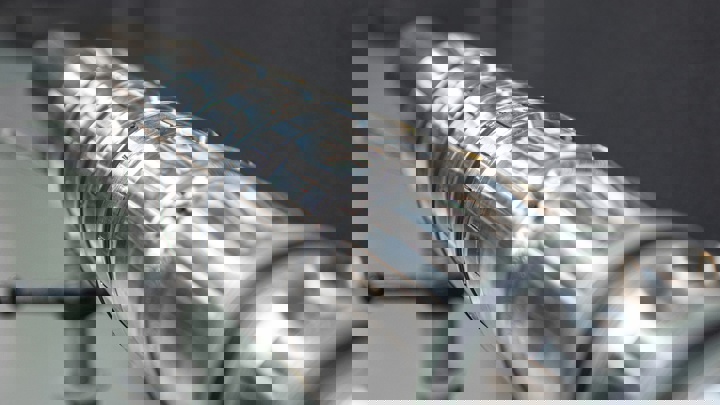 Close up of Welltec expandable WEA liner hanger a metal to metal sealing solution designed for reliable wellbore anchoring and zonal isolation